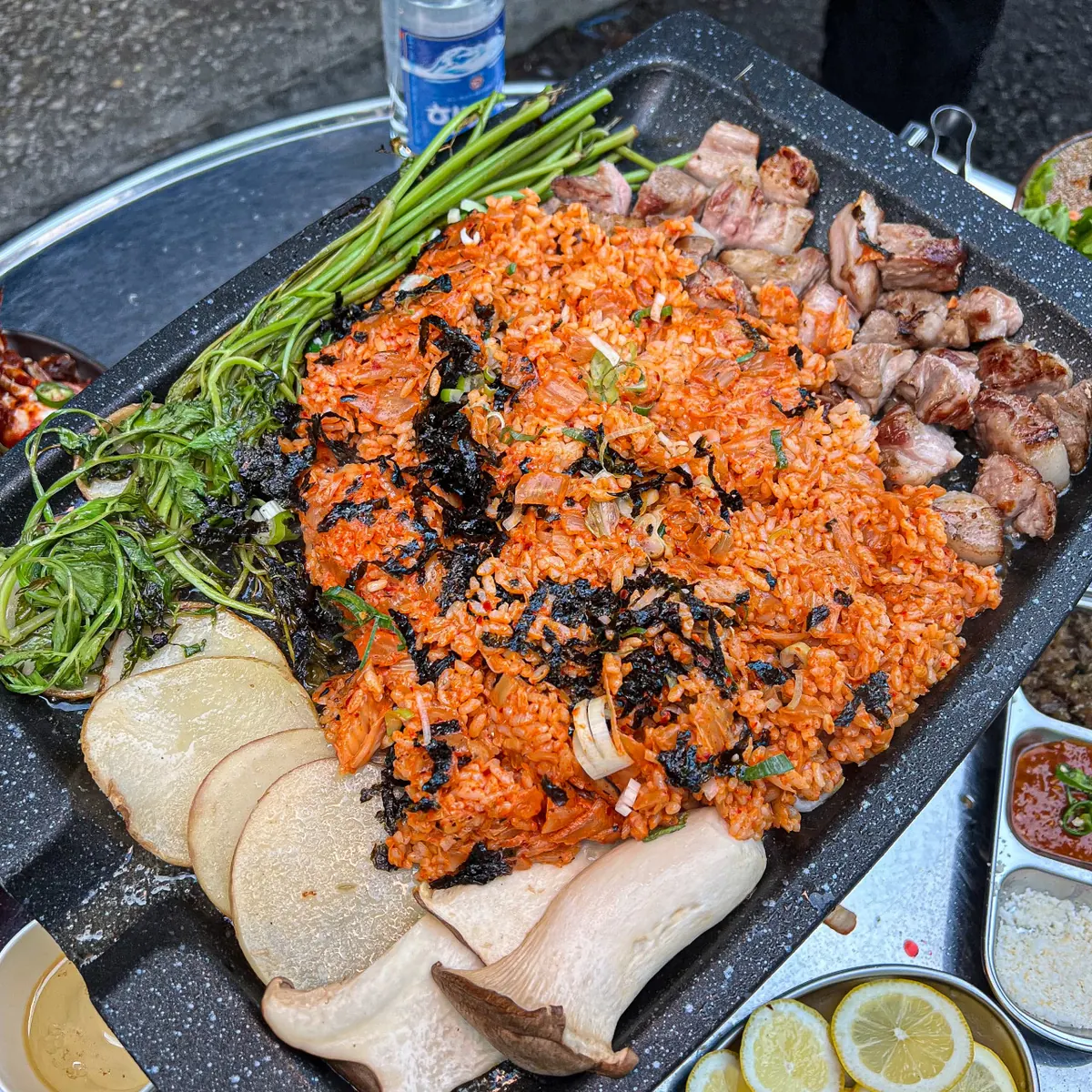 Kimchi fried rice cooked on the grill beside the aged pork and minari · 이태원 맛집 · Itaewon Korean BBQ